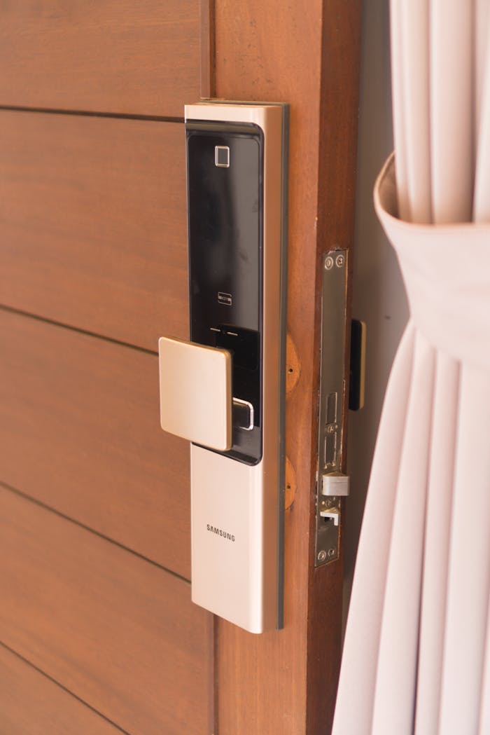 extra-programs-img Close-up of a smart door lock system, offering enhanced security on a wooden door.