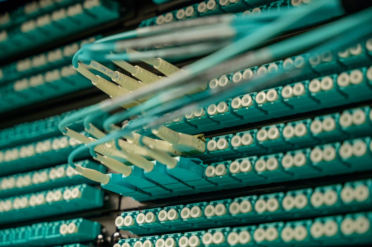 Mastering the First Impression: Your intriguing post title goes here Detailed view of fiber optic cables connected to a server rack, showcasing modern technology.