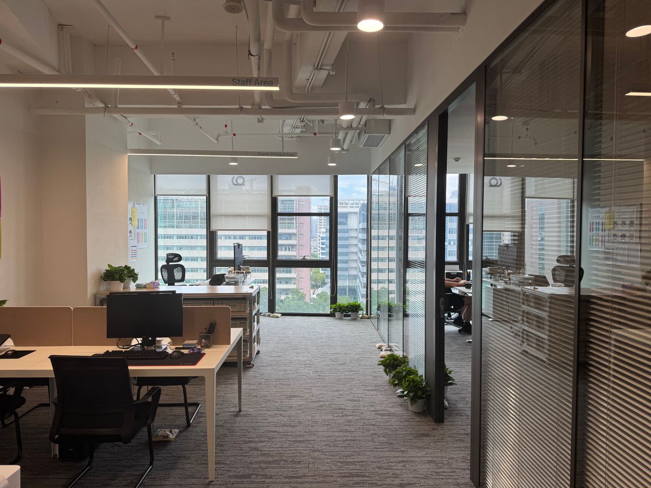 core-values Bright, modern office interior with large windows and open workspace design.