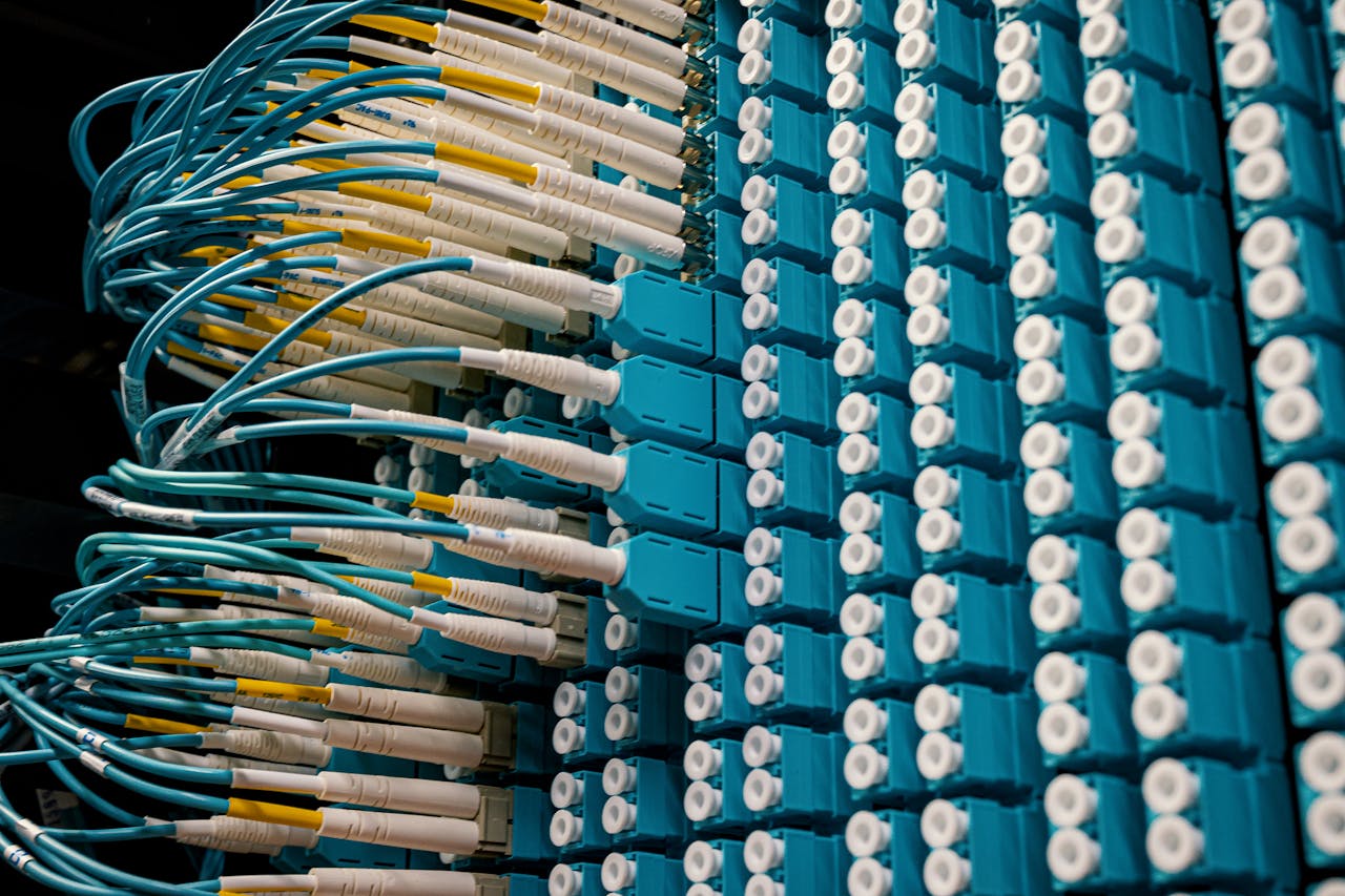 Hello world! From below of fiber optic equipment with similar colorful rubber cables and round sockets